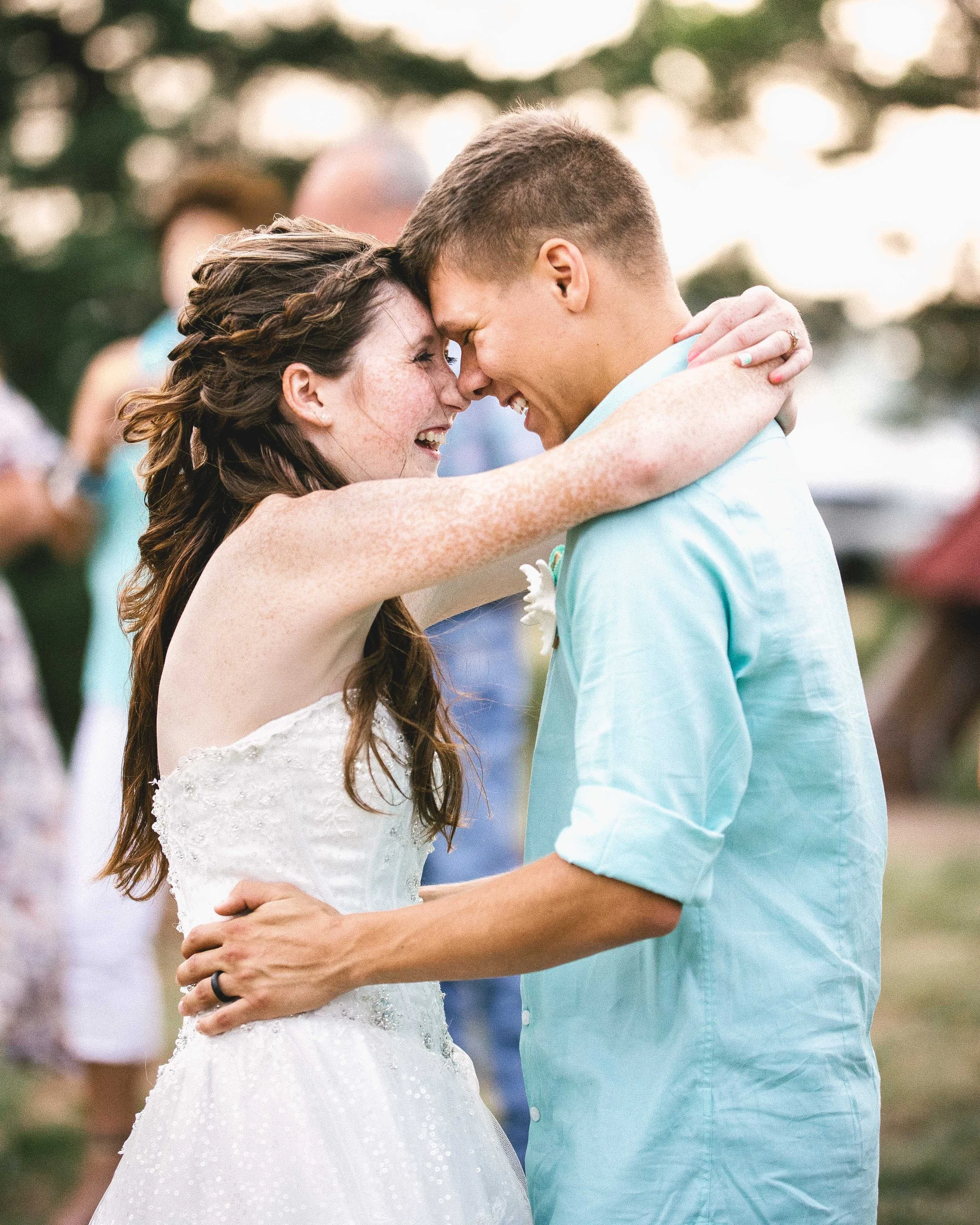 A newlywed couple embracing on their wedding day